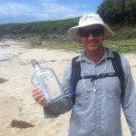 Ian Wells with the message in a bottle found by a Sydney Coast Walks' guest